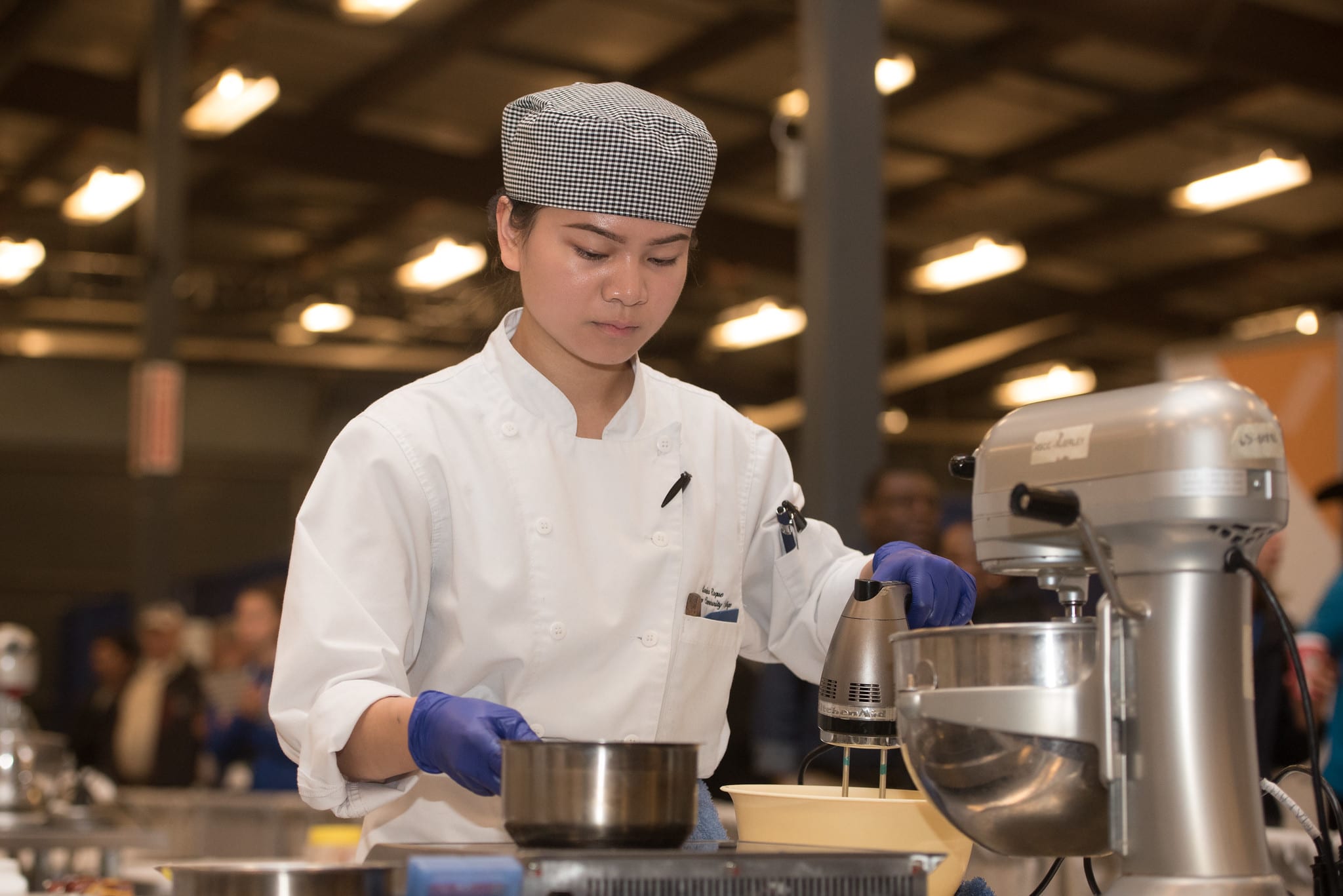 women using a mixer for baking